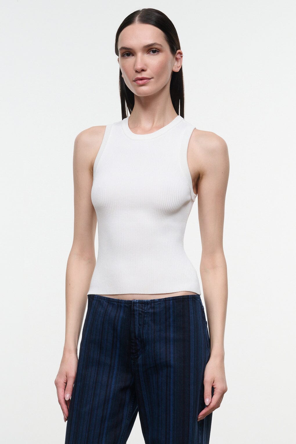 White ribbed tank top with crew neck and sleeveless cut
