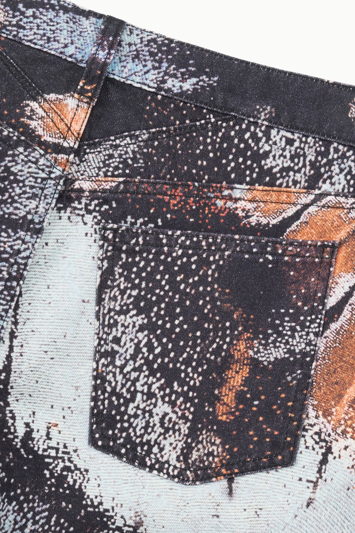 Abstract-print jeans pocket and waistband seam, black/white speckled with orange accents