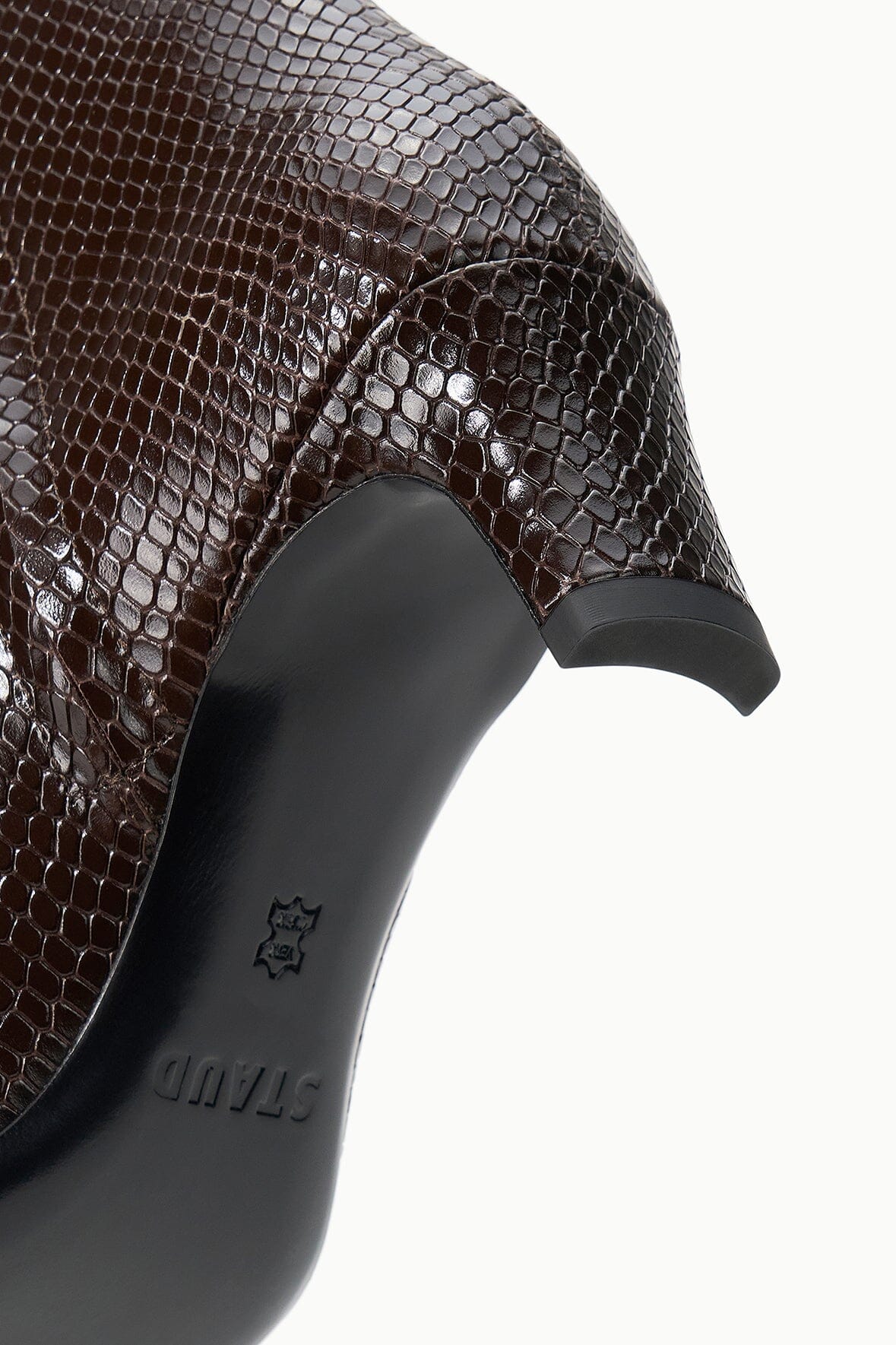 Snake-textured ankle boot with black trim and embossed logo detail