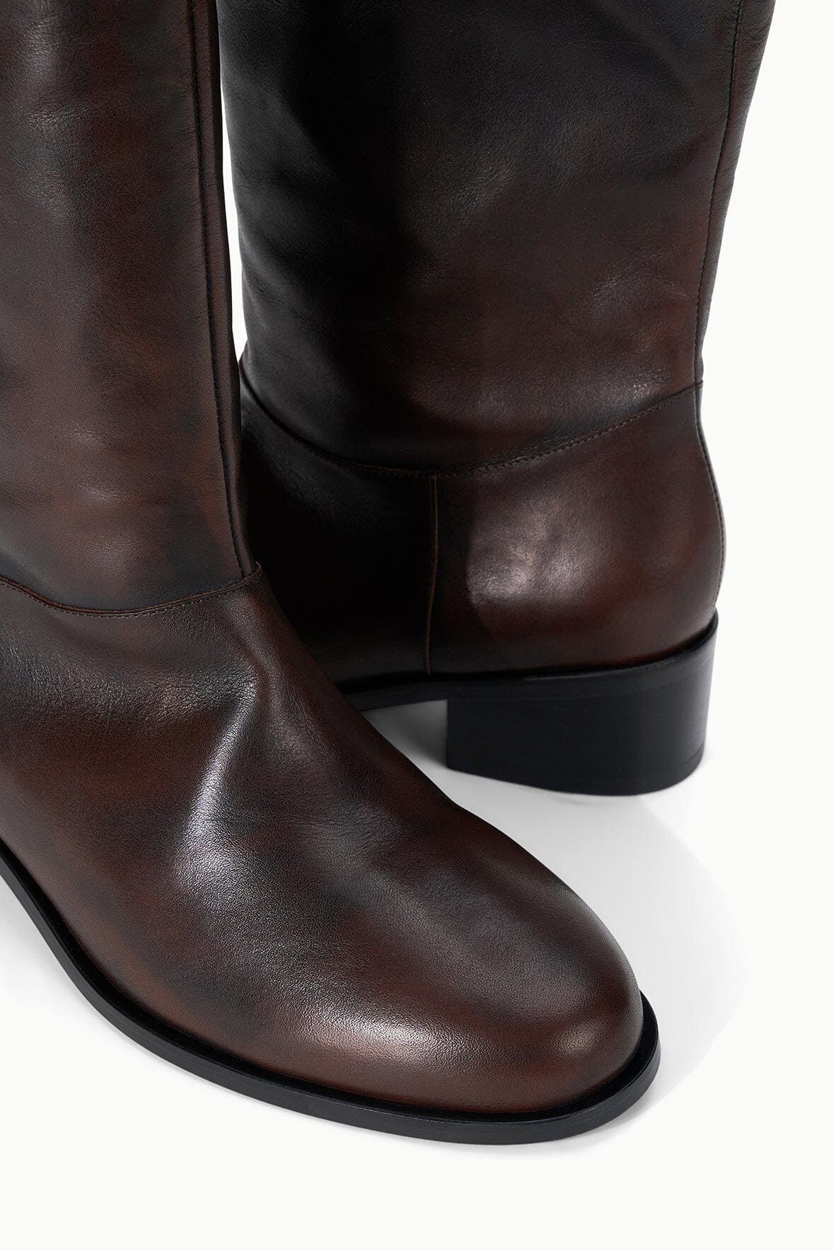 Over-the-knee boot shaft in dark espresso distressed leather with low block heel