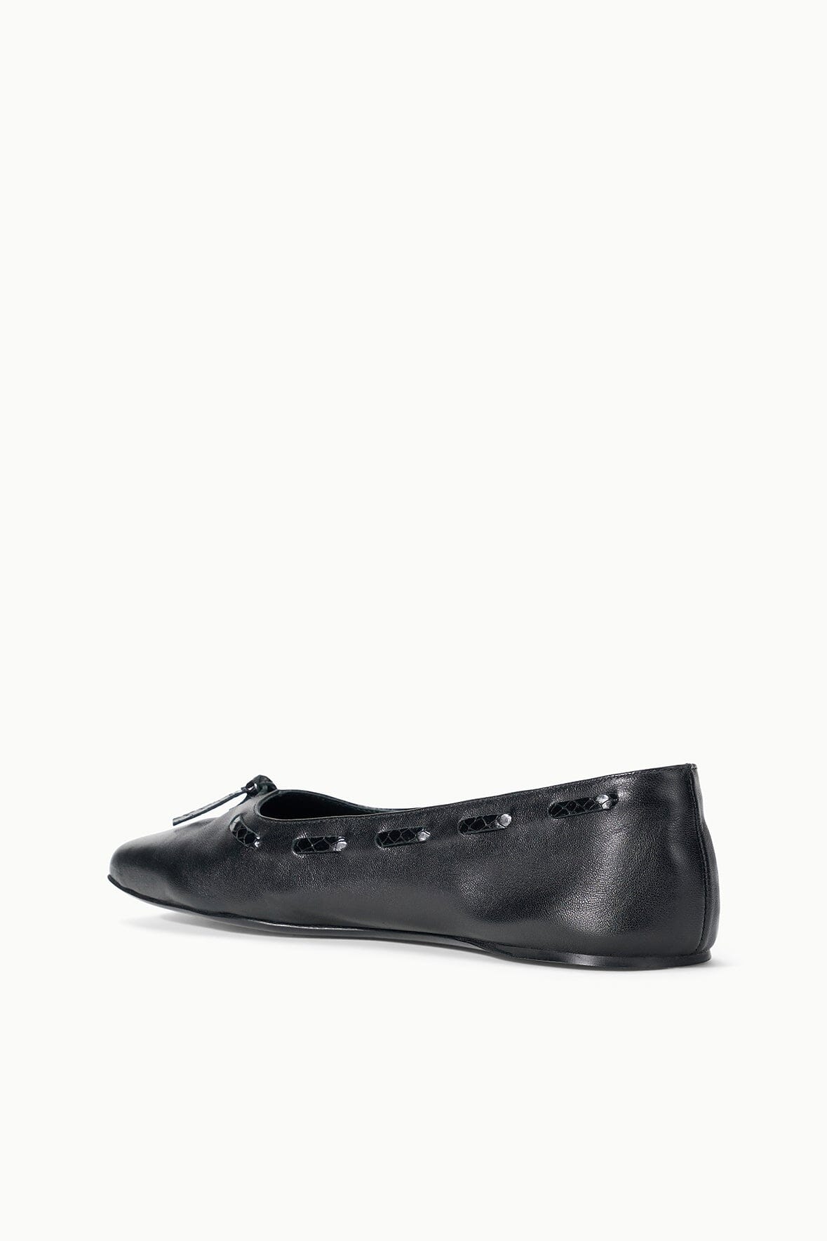 Black leather flats with bow at front and subtle perforation detail