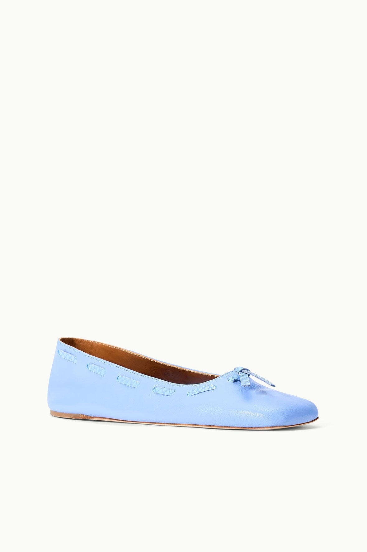 Light blue flat ballet flats with bow detail and textured upper stitching