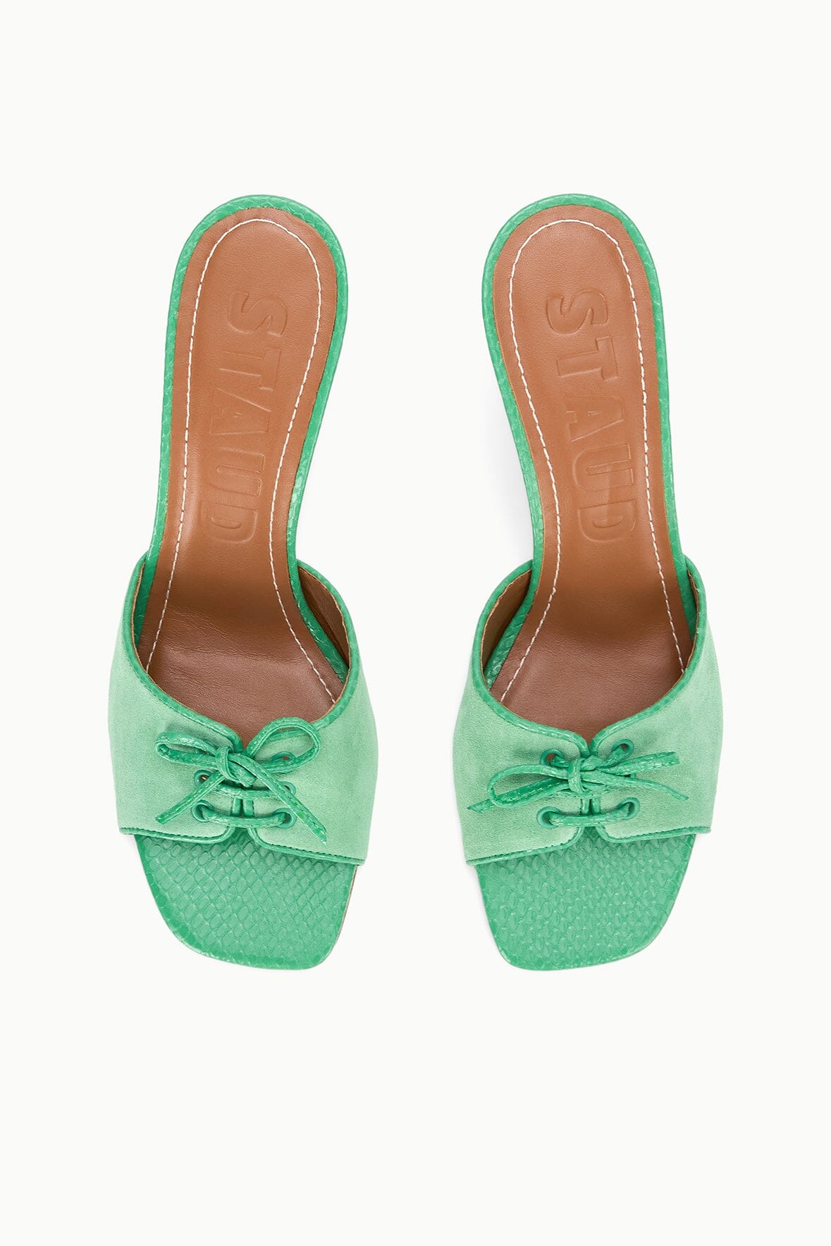 Seafoam suede mule heels with lace bow, open toe, and tan sole underside
