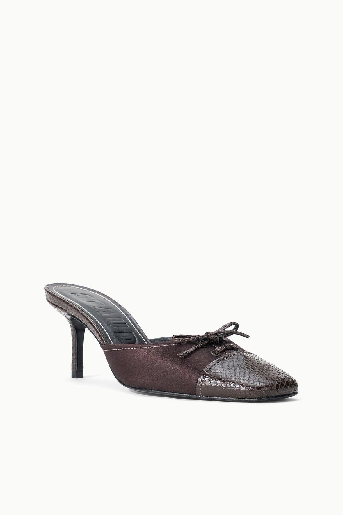 Espresso mule with snake-print upper, lace front, and slim stiletto heel.
