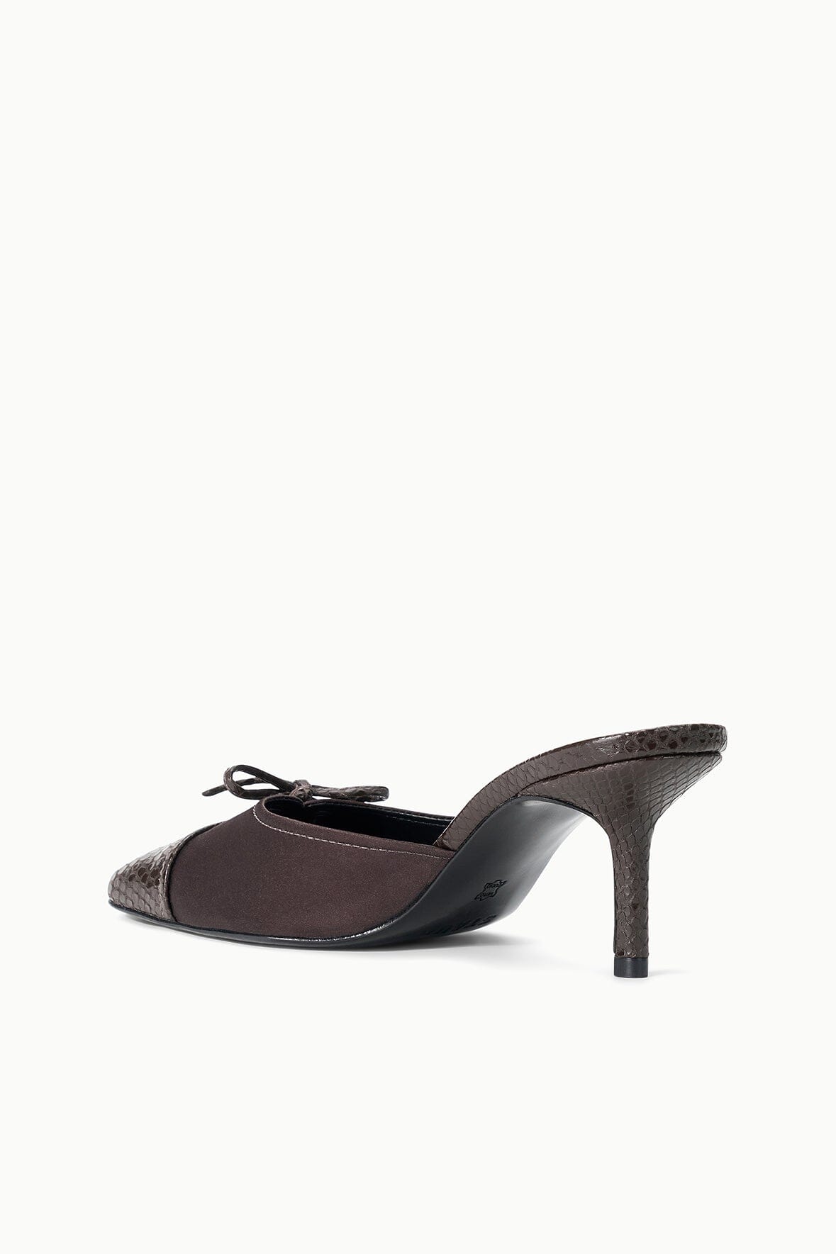 Espresso mule with snake-texture upper, lace front, and narrow stiletto heel.