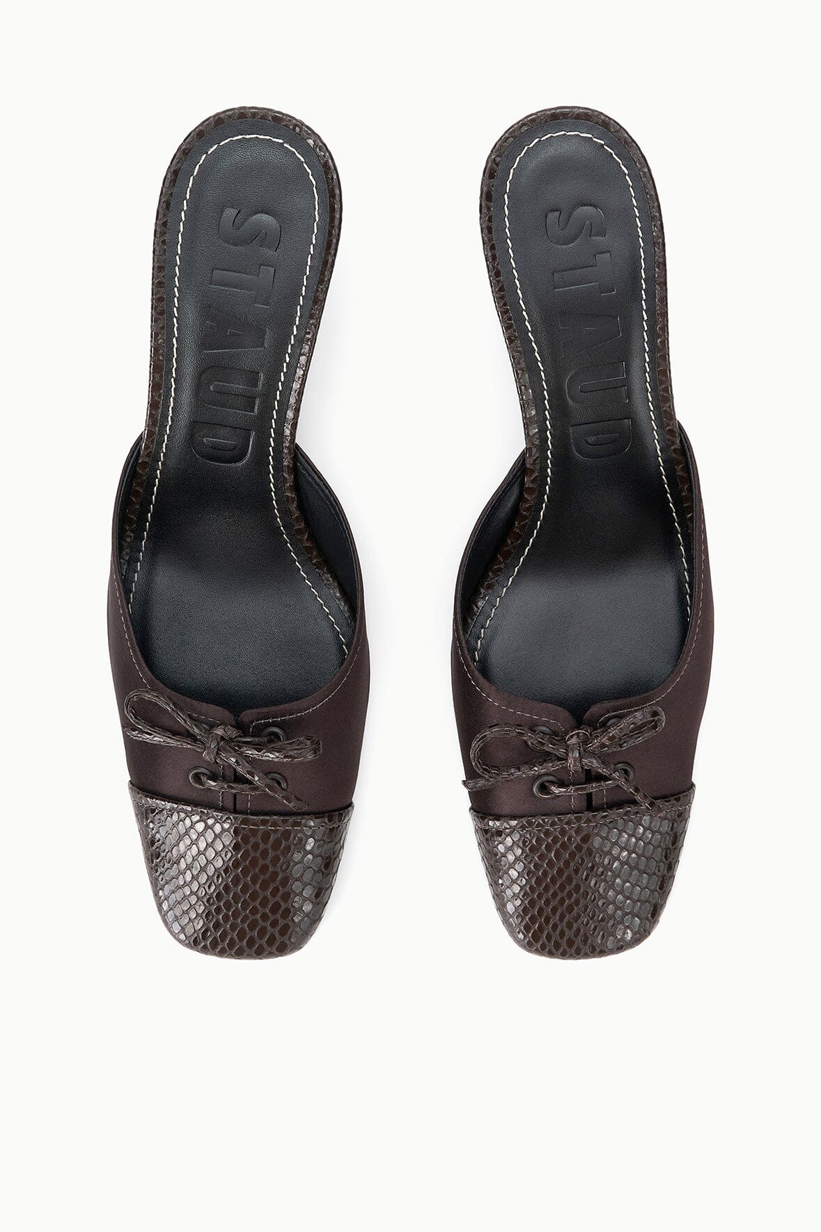 Espresso mules with snake-texture toe and lace-up front, top view.