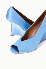 Sky-blue peep-toe wedge heels, angled view showing open toe and wedge profile