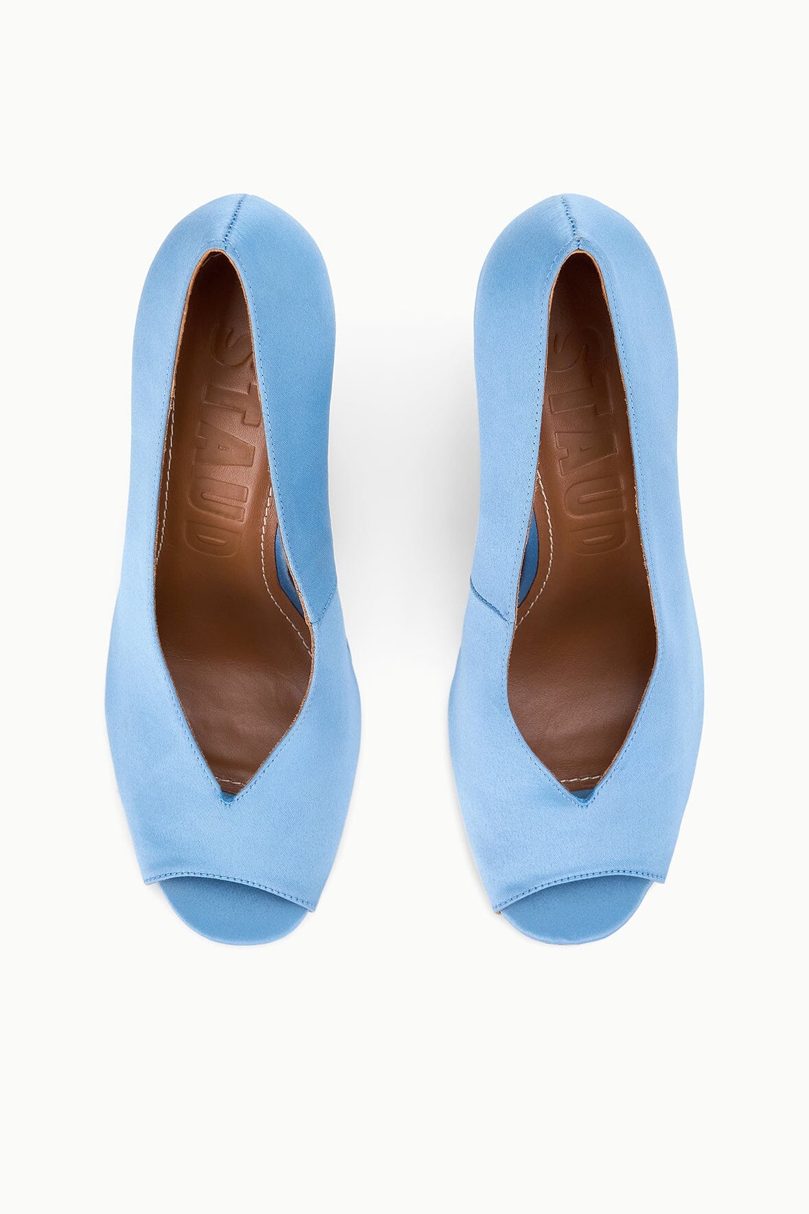 Pair of sky-blue peep-toe wedge heels with open toe and woven-look insole