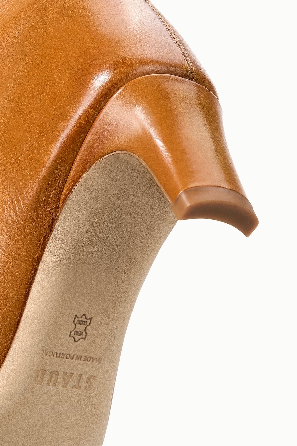 Cashew distressed knee-high boot with printed insole logo on tan lining