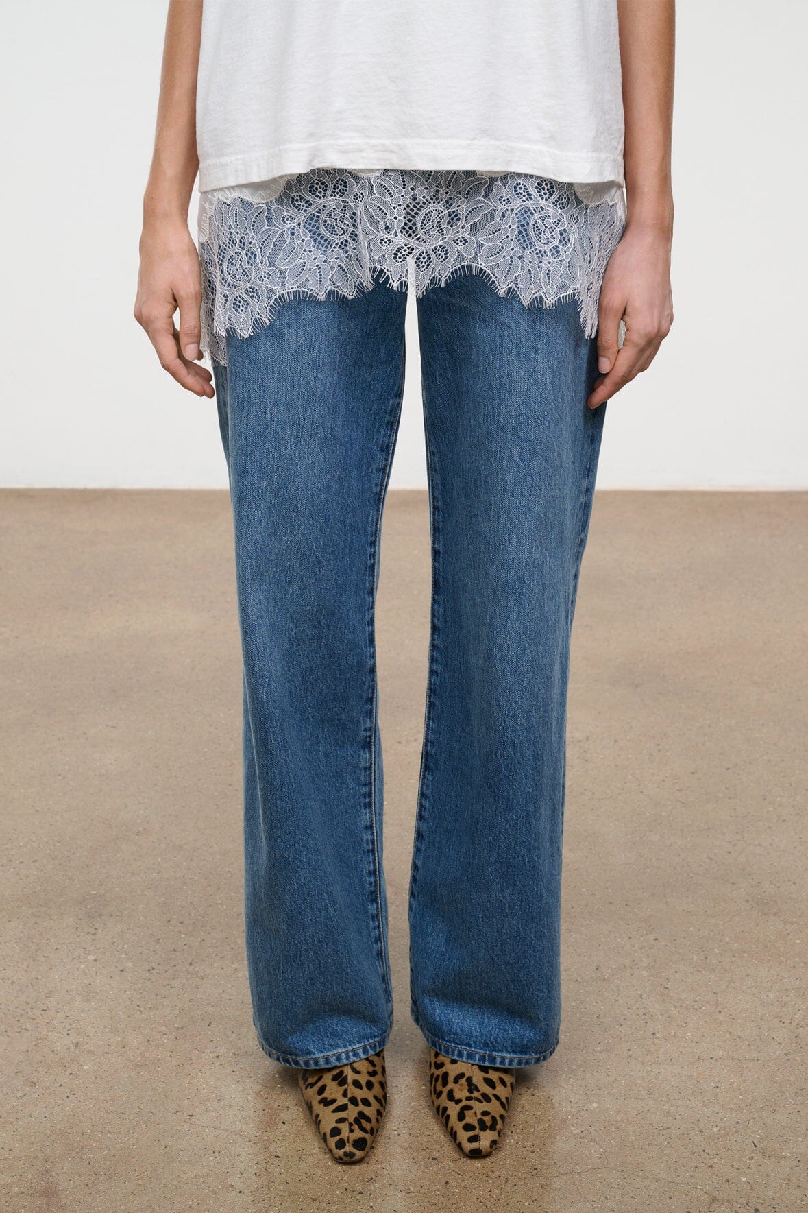Cheetah-print ankle boots with low heel, worn with blue jeans