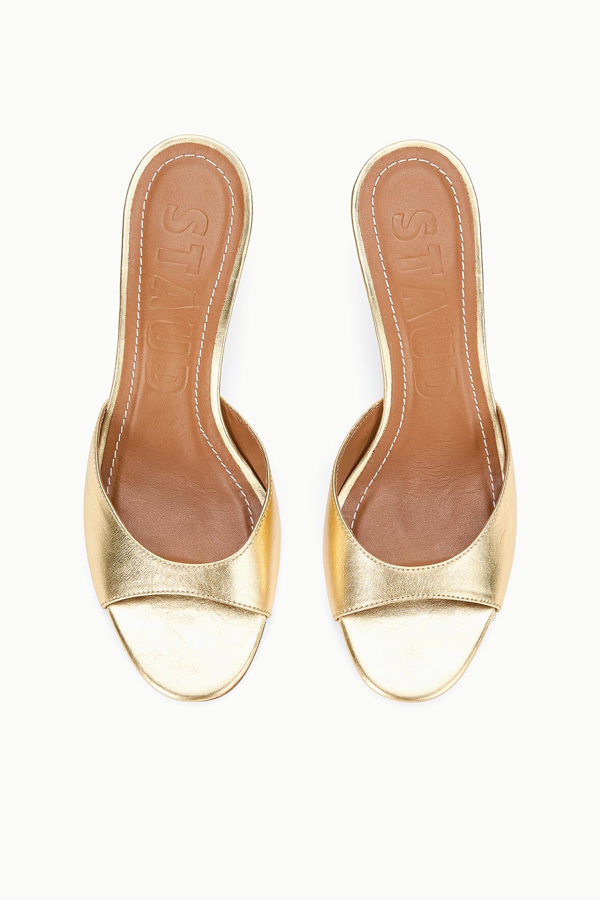 Gold leather mule sandals with open toe and low heel, leather lining