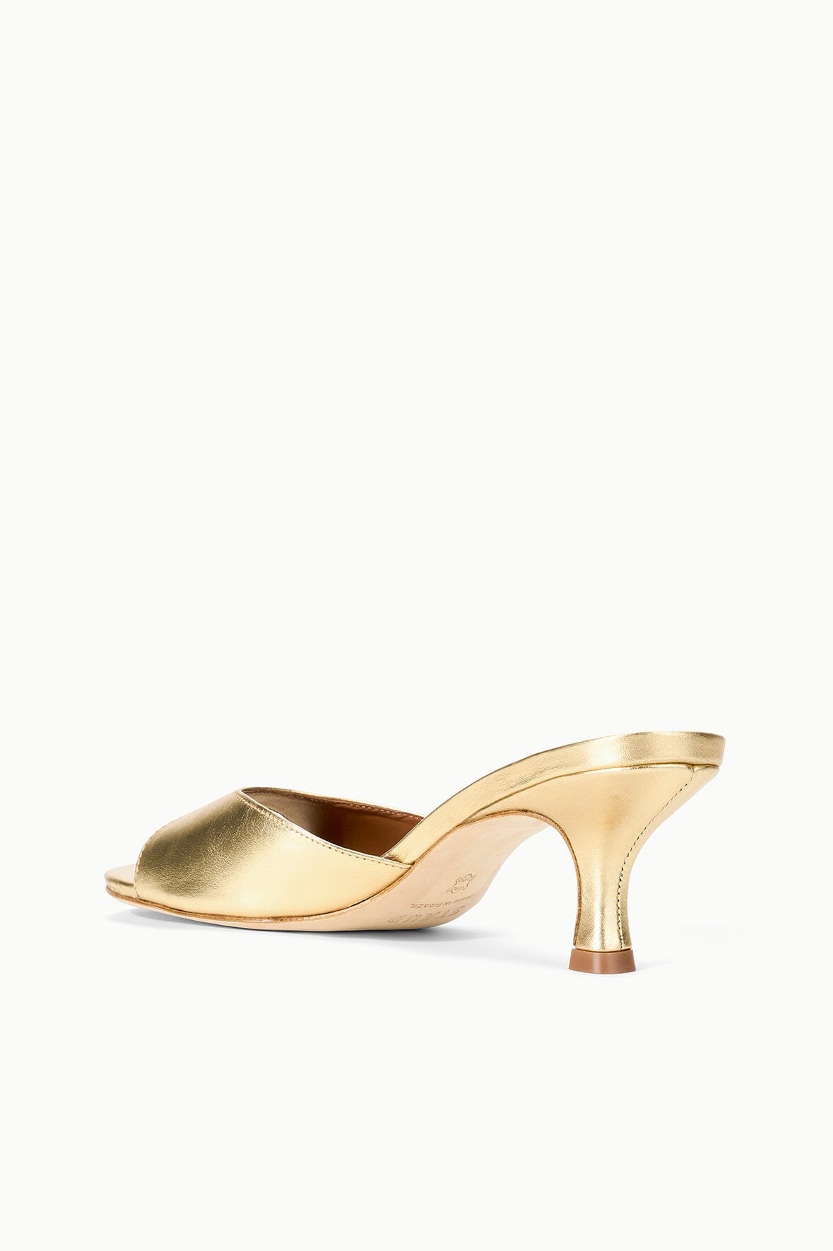 Gold metallic leather mule sandal with open toe and curved block heel