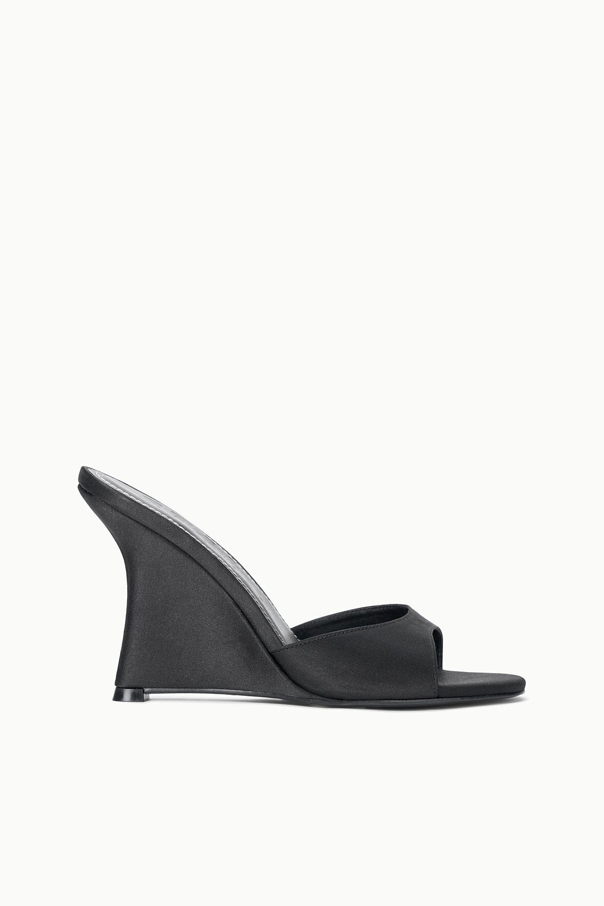 Black satin high-wedge slide sandal, side view with open toe and platform wedge