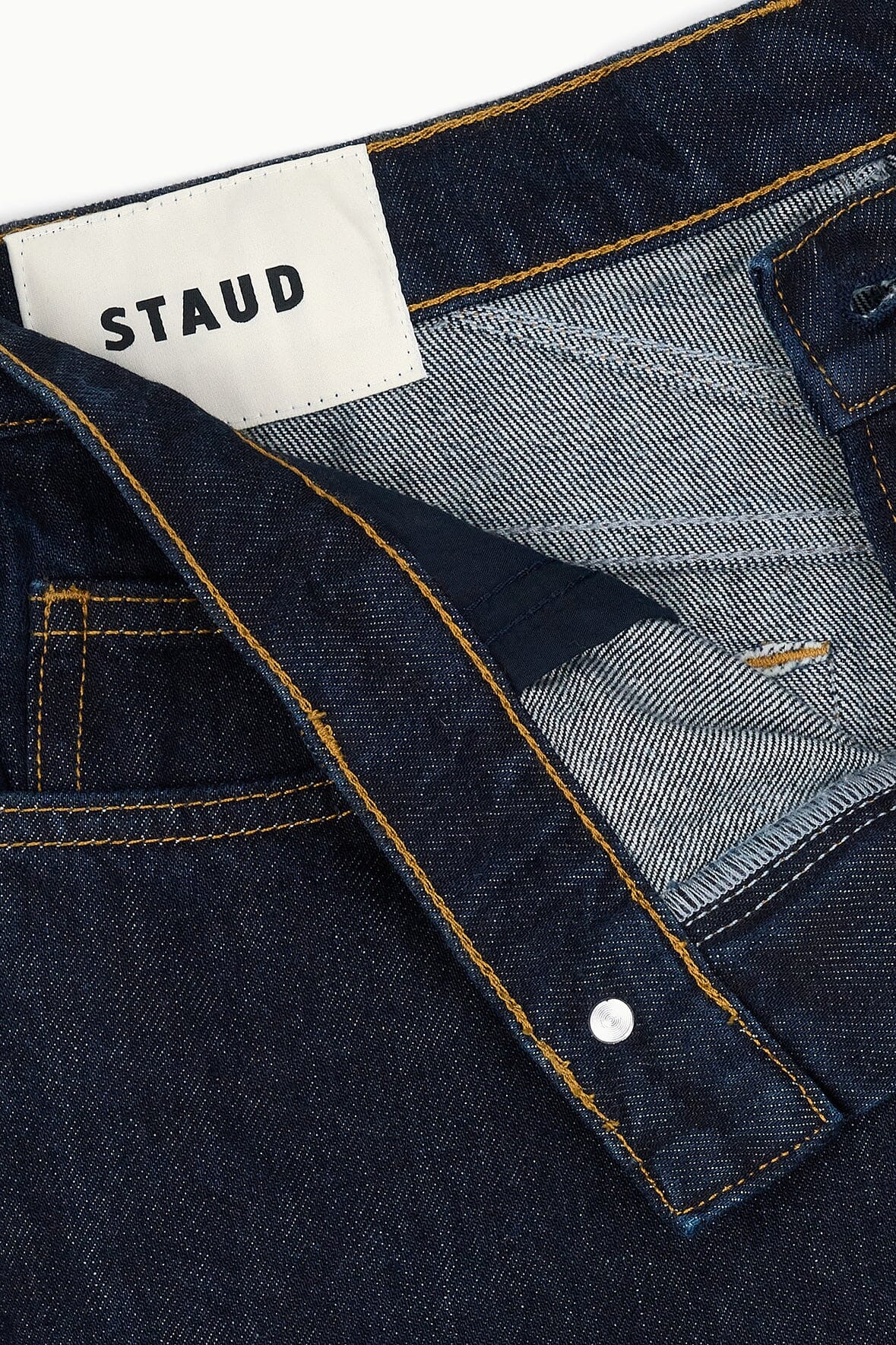 Indigo jeans waistband label and contrast topstitching