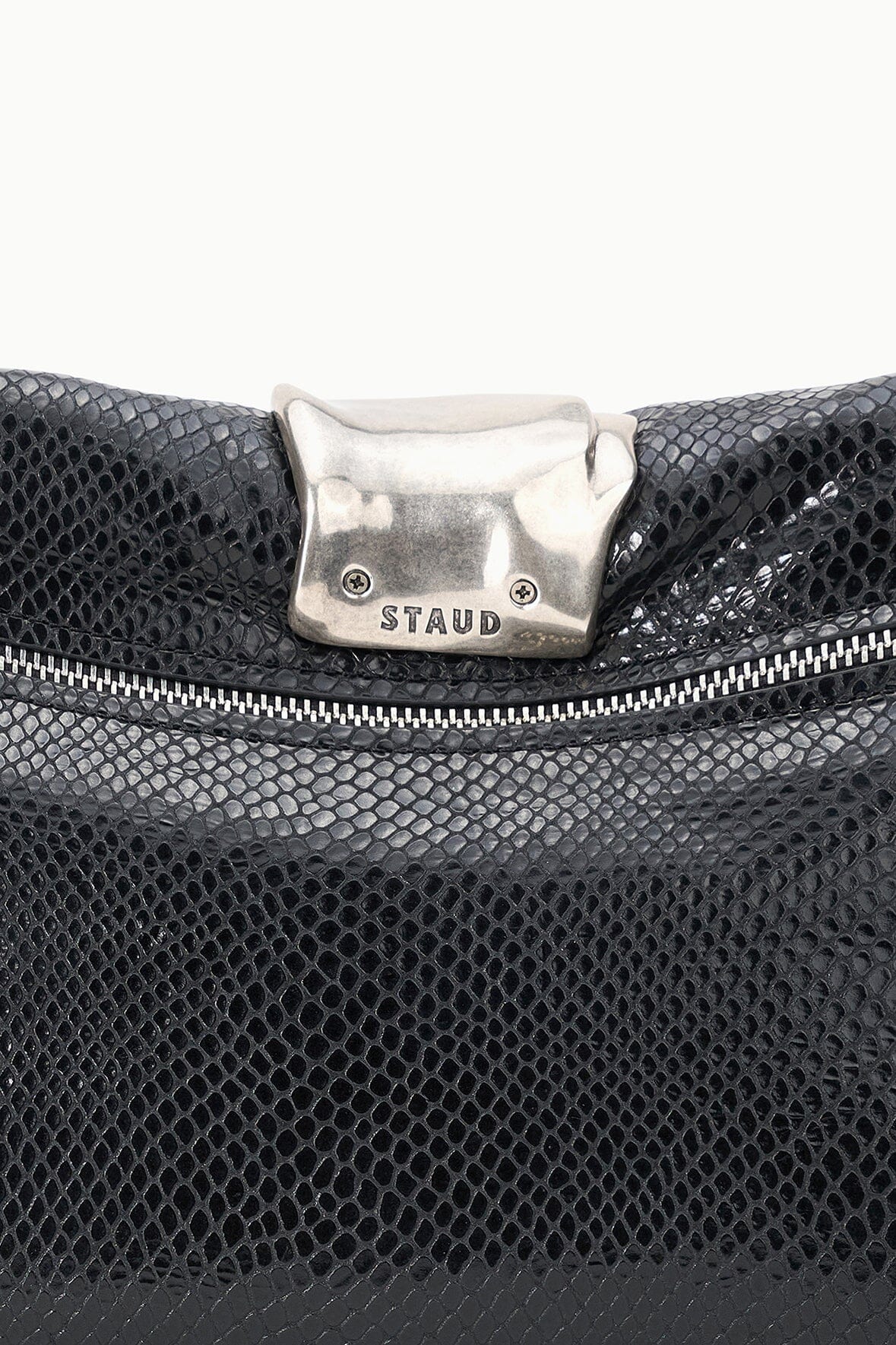 Black snake-texture clutch close-up with silver-tone clasp and top zipper