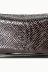 EVE clutch close-up: dark brown embossed snake pattern with smooth trim edge
