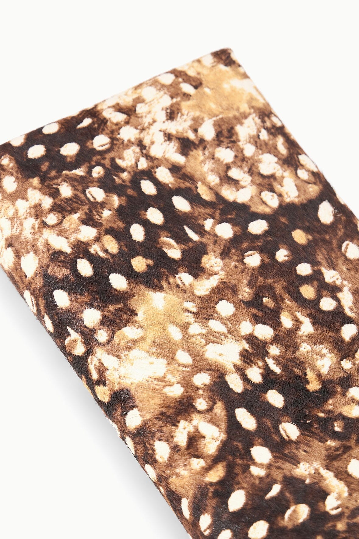 Close-up of fawn haircalf clutch fabric with brown and tan speckled spots