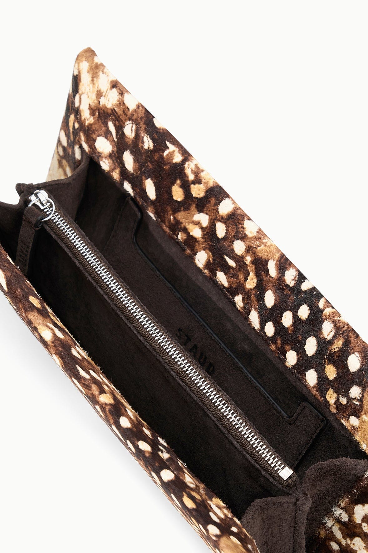 Fawn haircalf clutch interior with zip opening and brown/tan speckled lining