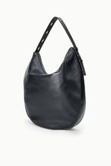 Black hobo bag angled view with top handles and side zip detail
