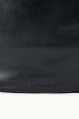 Black hobo bag with embossed STAUD logo near bottom front