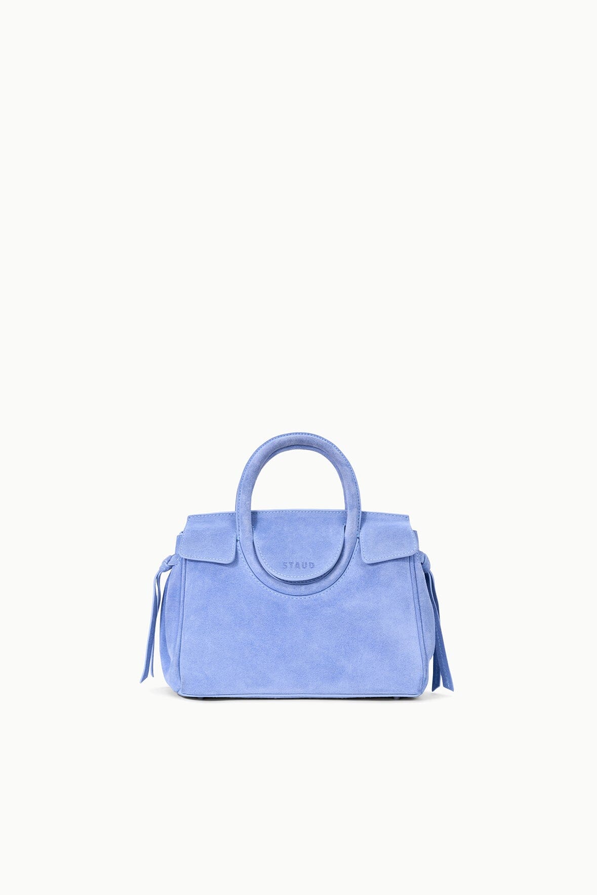 Light blue mini carryall handbag with top handles and subtle side tassel details
