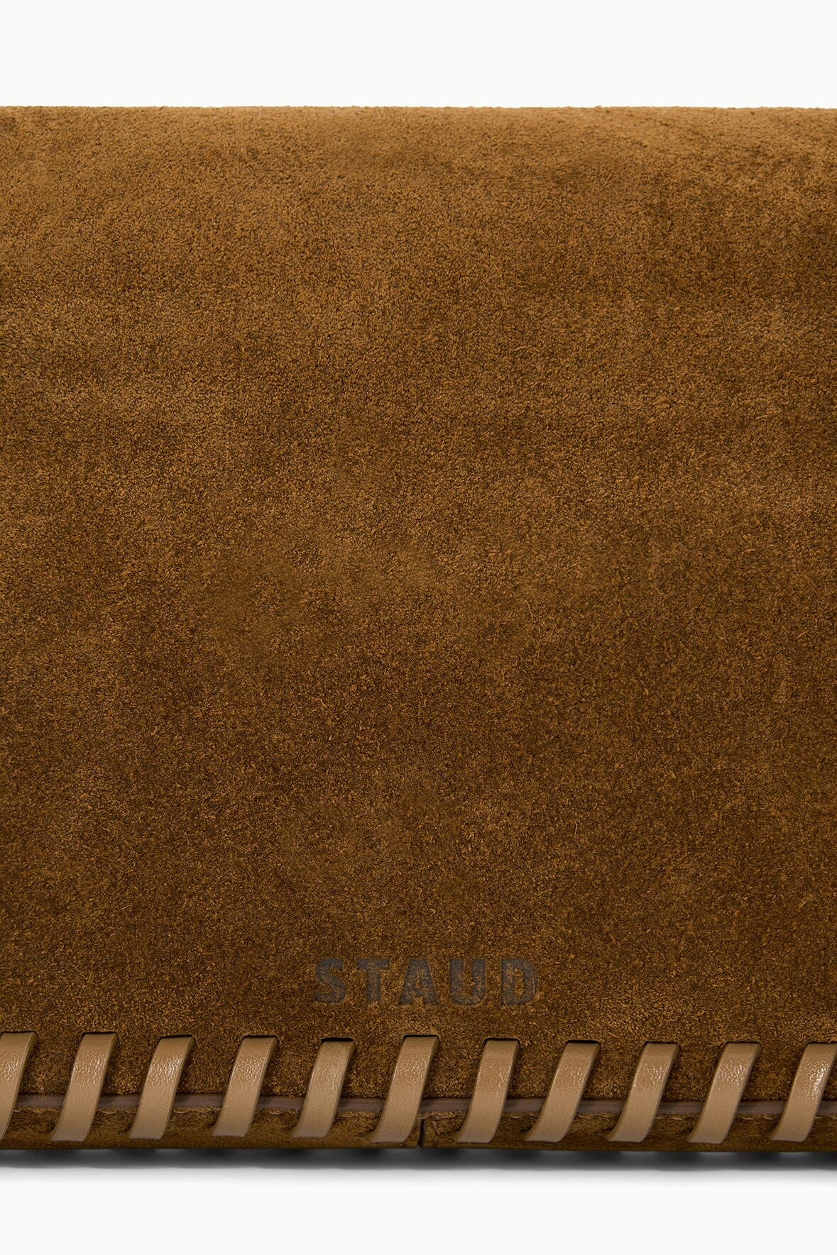 Cigar-brown suede handbag with fringed trim and subtle STAUD logo