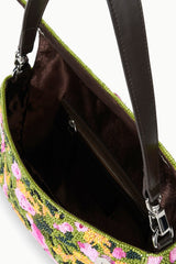 Interior of woodland print convertible shoulder bag with dark lining and zipped compartment