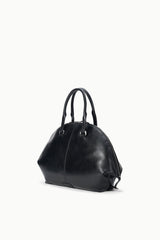 Black satchel bag with short top handles and rounded structured shape