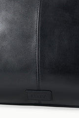 Black satchel bag with stitched seam and HESTER logo plaque