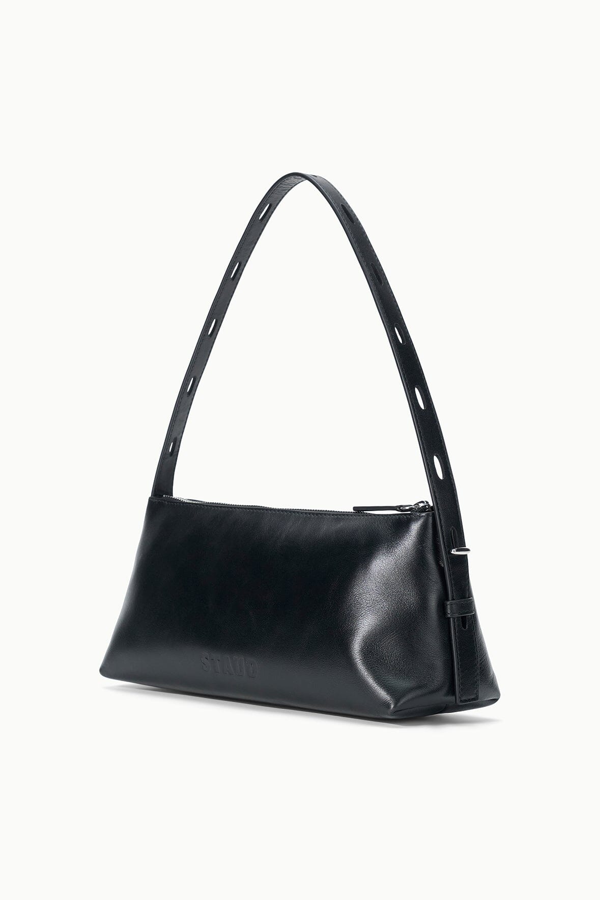 Black shoulder bag with long straps and structured, angled front