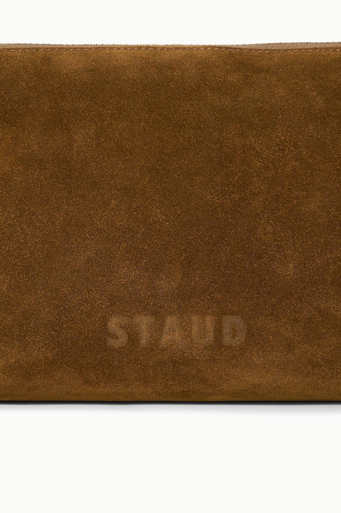 Brown suede shoulder bag with embossed logo on the front panel