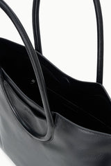 MAUDE black tote interior view with open top, two sections, and stitch detailing