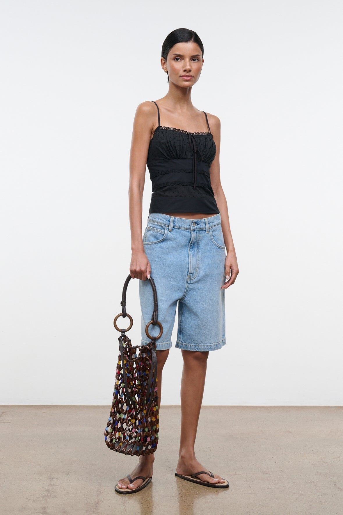 Del Mar bucket bag in multicolor beaded lattice with round ring handles and black trim