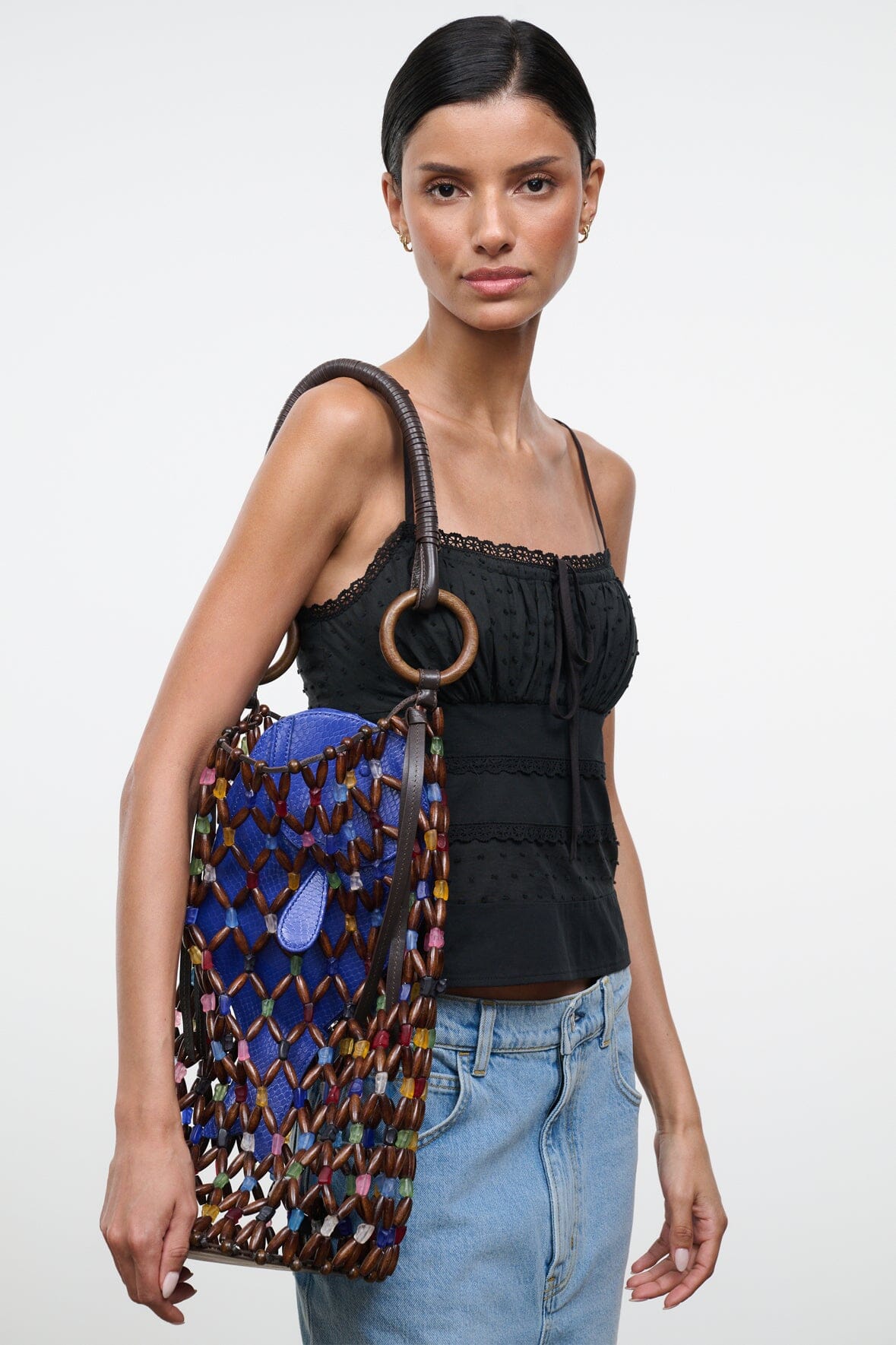 Del Mar bucket bag with multicolor diamond beaded lattice, black straps, and round ring handle