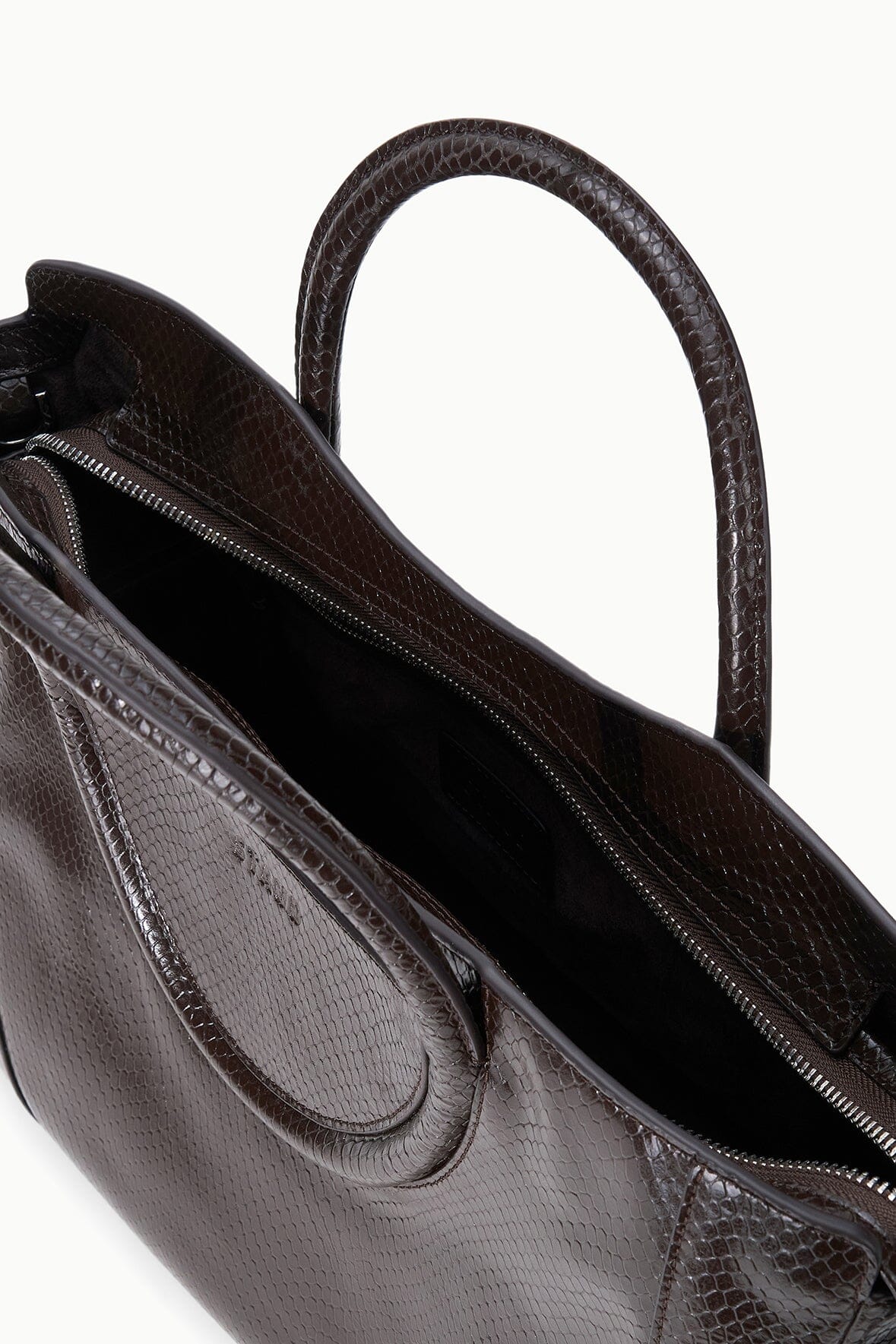 Espresso snake-embossed satchel interior view with zip closure and dual compartments