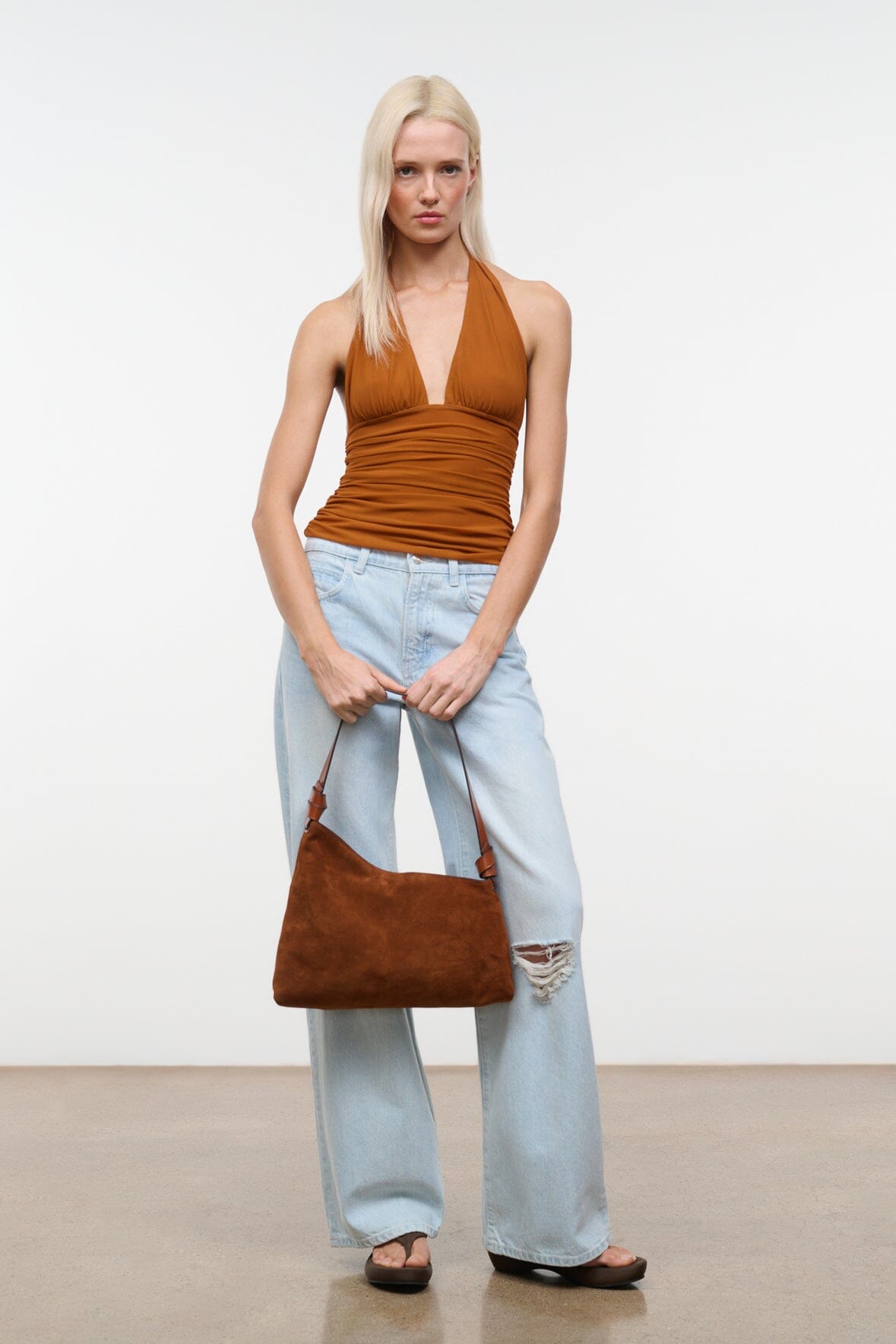 Tabac suede shoulder bag with adjustable strap and slouchy hobo silhouette