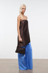 Mini shoulder bag in dark brown suede with silver studs, carried with shoulder strap.
