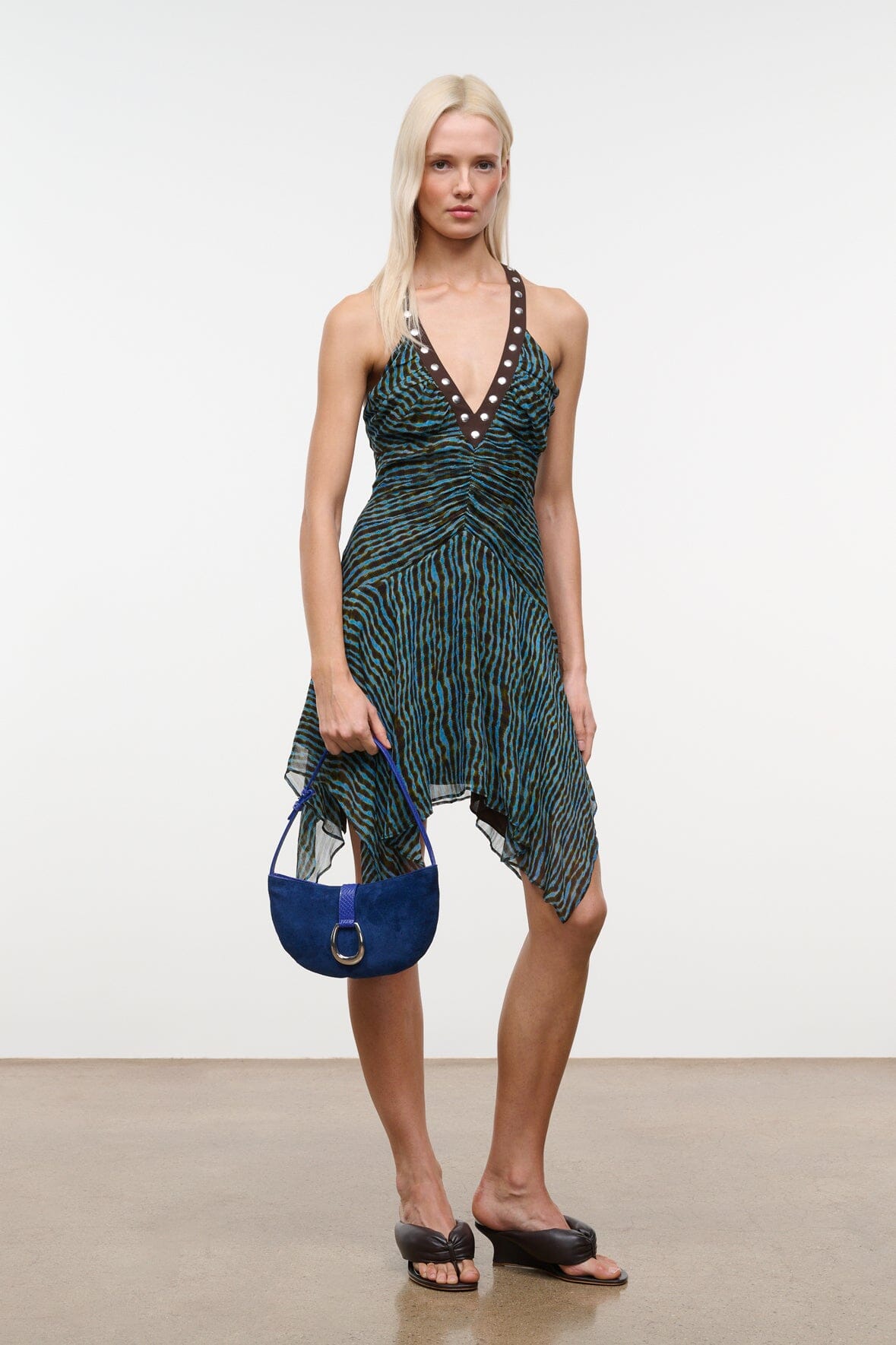 Cobalt crescent suede shoulder bag with adjustable strap and ring buckle