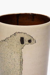 Tall ceramic sheep vase rim and sheep face detail on speckled beige