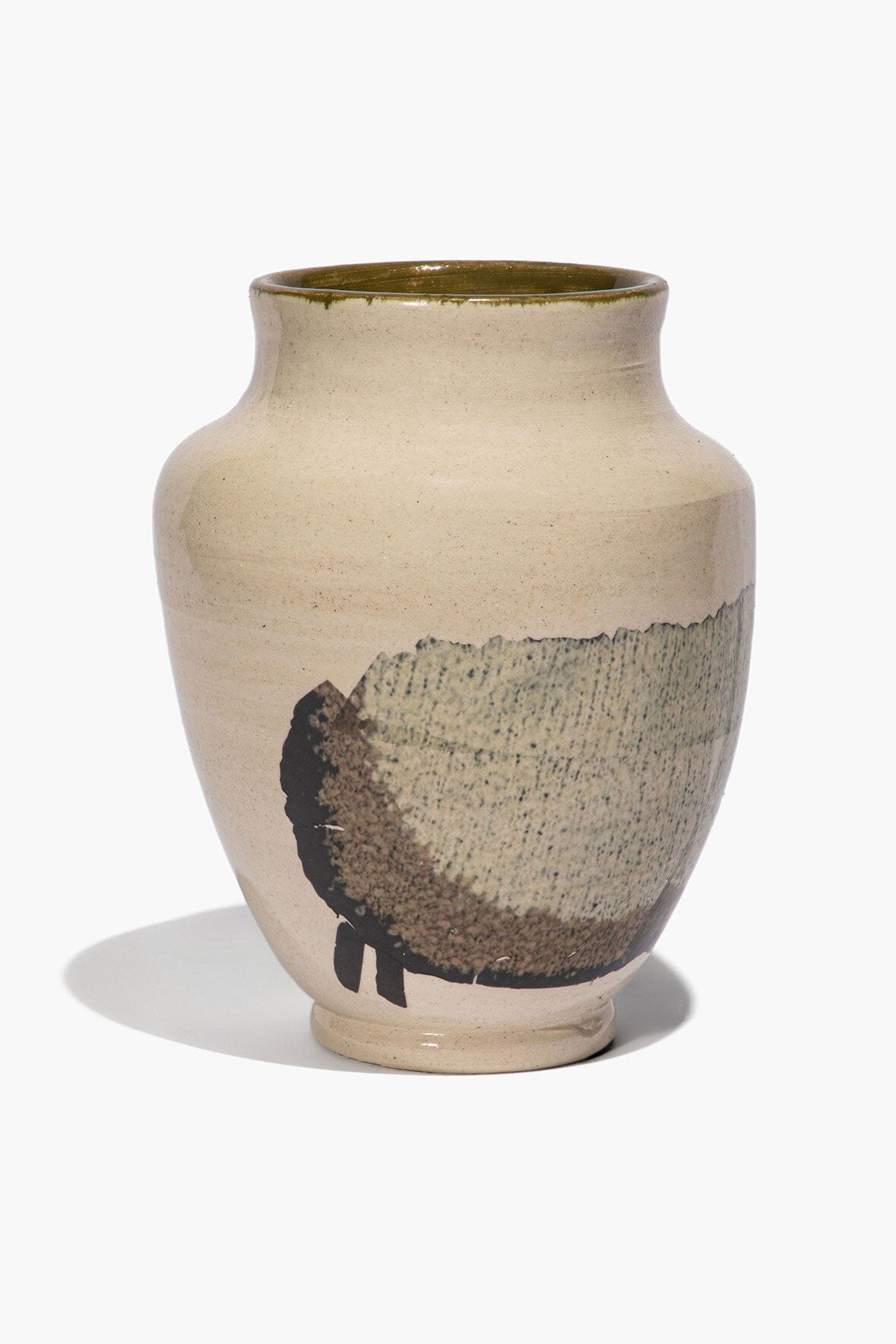 Round ceramic sheep vase with beige body, black sheep silhouette, and green glazed rim