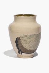 Round ceramic sheep vase with beige body, black sheep silhouette, and green glazed rim