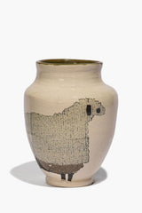 Beige round ceramic sheep vase with black sheep silhouette and speckled finish