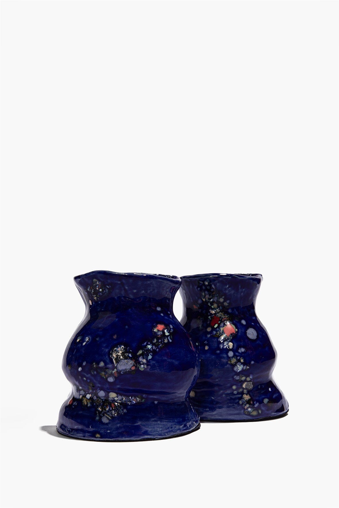 Ceramic vase bookends in dark blue with speckled polka-dot glaze