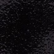 Close-up of glossy black glaze ceramic texture with speckled sheen