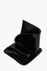 Black glazed wavy stationary holder with rounded pen slot and front base