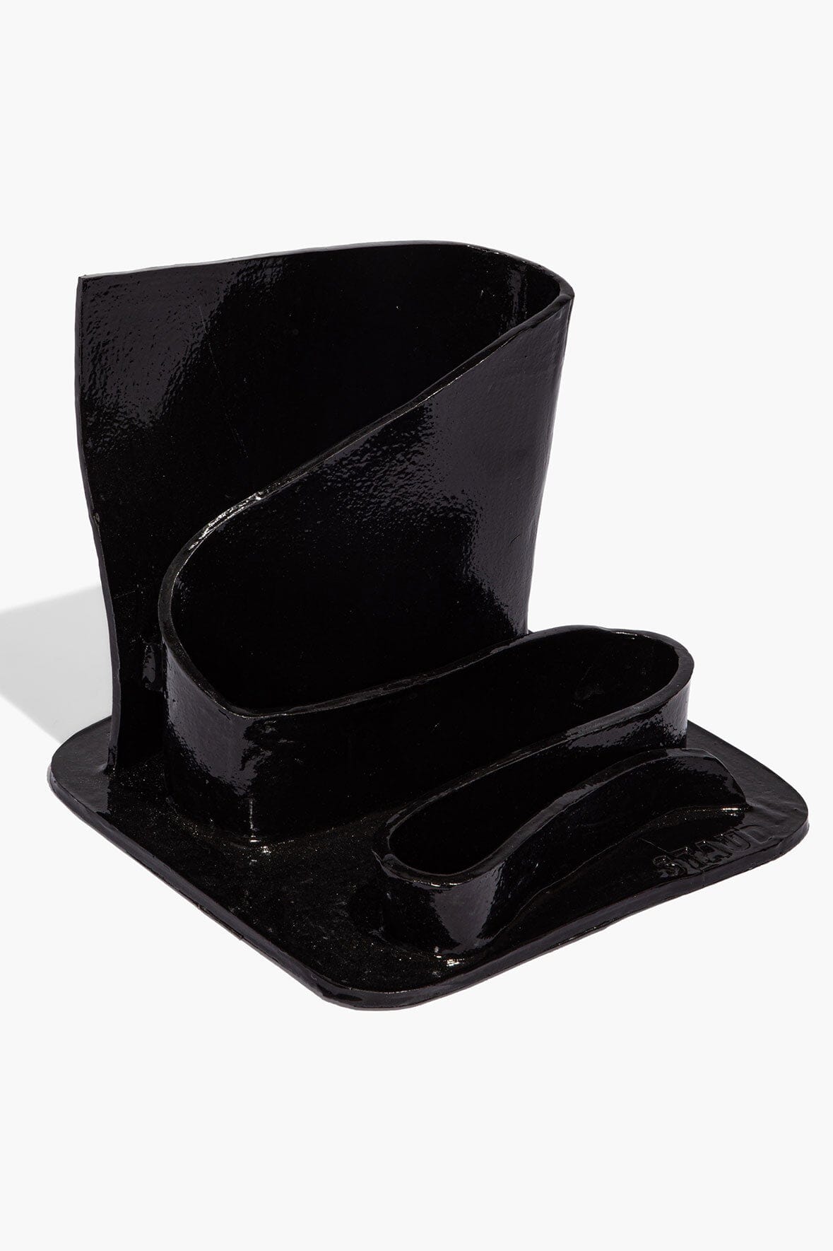 Black glazed stationary holder with two compartments and glossy wavy walls