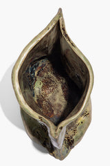 Ceramic vase top view, open interior with dark glaze and mottled speckled finish