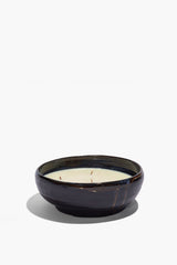 Large ceramic candle bowl with off-white wax top and dark glazed rim
