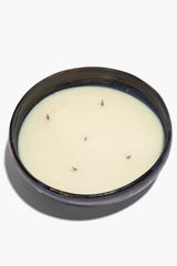 Large ceramic candle in dark bowl, white wax with exposed wicks