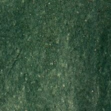 Forest-green glazed ceramic surface texture with speckled finish